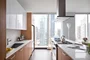 Gourmet kitchens with Snaidero duotone cabinetry and quartz countertops