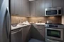 Tribeca Tower features gourmet kitchens with full-sized stainless steel appliances, custom wood cabinetry and white stone countertops. 