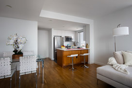 Light filled living rooms offering stunning views of New York City.