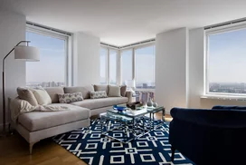 Light filled living rooms offering stunning views of New York City.