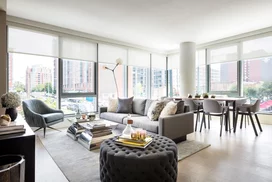 Large windows offer light-filled living with spectacular city views