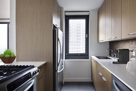 Tribeca Tower features gourmet kitchens with full-sized stainless steel appliances, custom wood cabinetry and white stone countertops. 