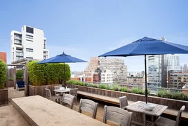 Perfectly planned landscaping on the rooftop terrace offers the ideal location to take in sweeping views of the Hudson River.