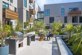 Landscaped courtyards with outdoor grills and dining