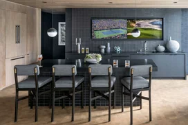 Multiple big-screen monitors make the Sports Lounge an ideal venue for viewing everything from the Oscars to the Super Bowl, and also features a custom-designed pool table and a bar with a Kegerator. 