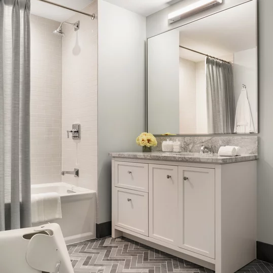 Second bathroom allows extra space and storage for family and guests.